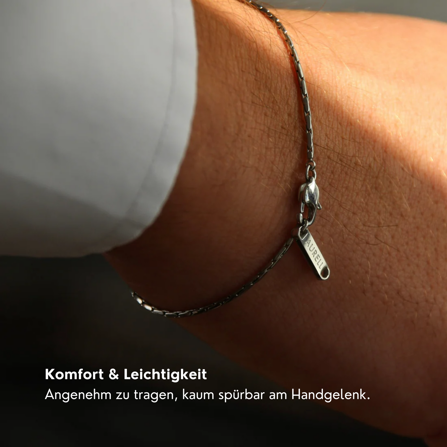 Edelstahl Armband, geflochten mit AURELL Logo an Handgelenk Herren
