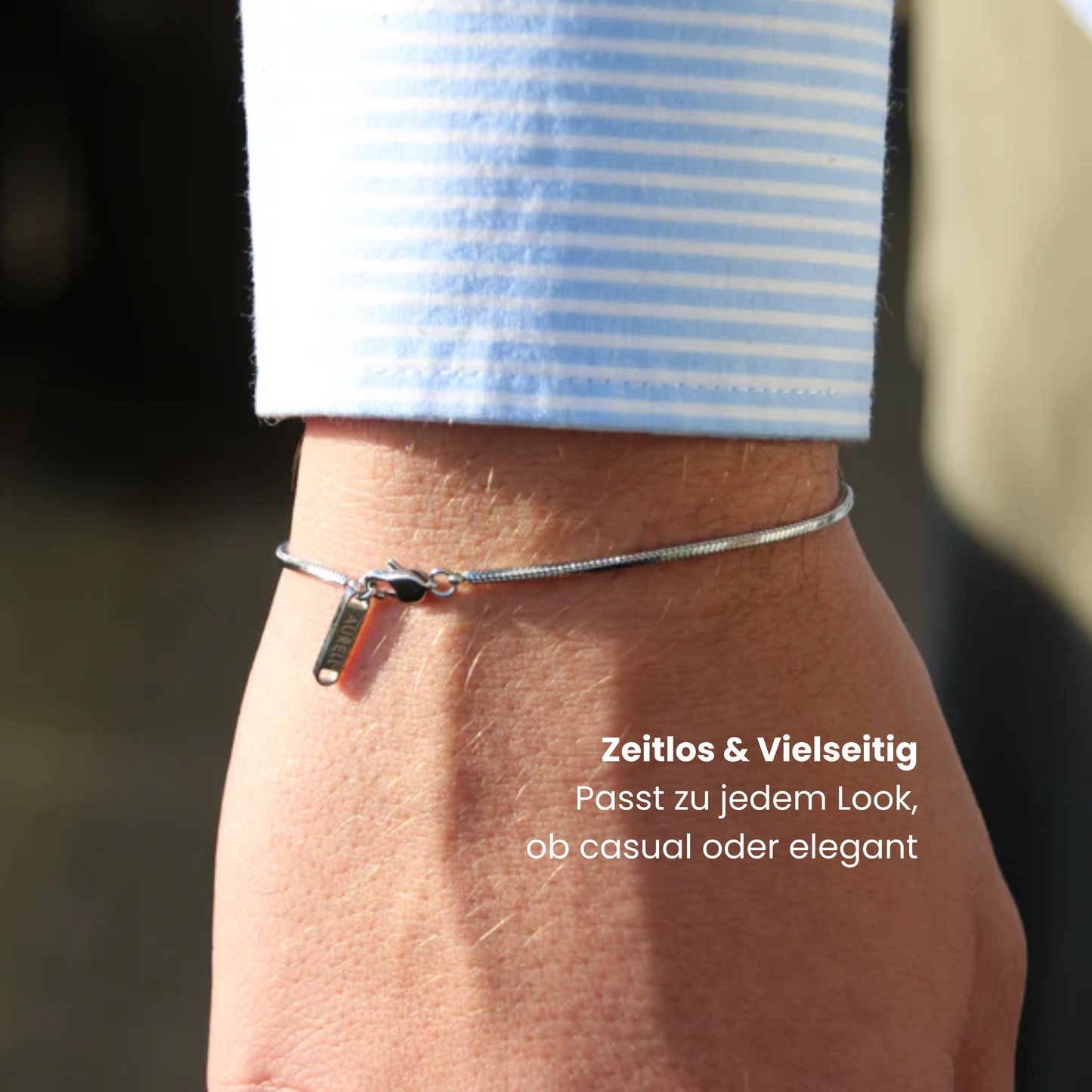 Edelstahl Armband, geflochten mit AURELL Logo an Handgelenk Herren