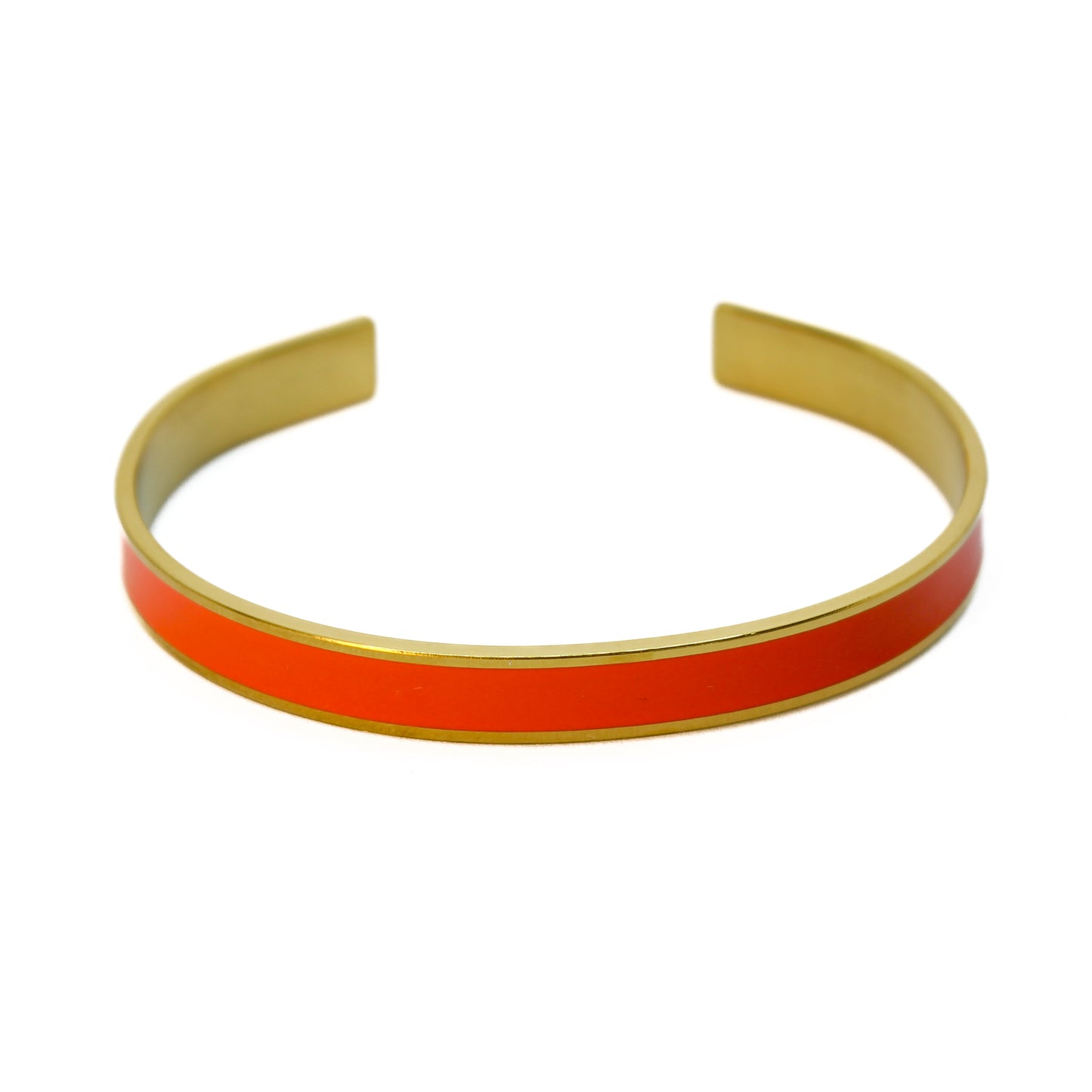 Armreif Orange Gold elegant auf weißem Hintergrund Damenschmuck