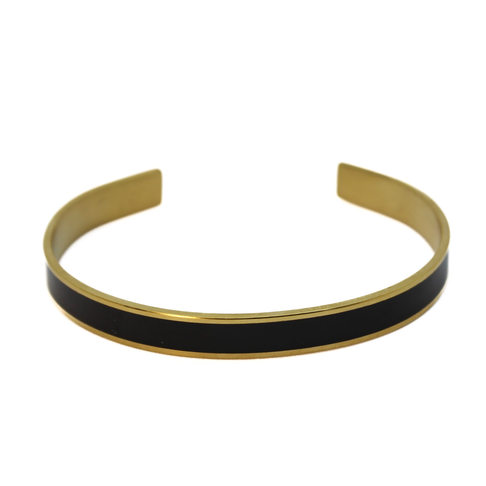 Armreif Schwarz Gold elegant auf weißem Hintergrund Damenschmuck